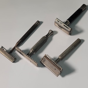 4 Antique safety razors.      (1297)