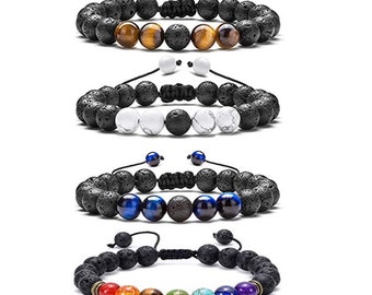 May include: Four adjustable beaded bracelets. The bracelets feature black lava rock beads paired with various gemstone beads, including tiger's eye, white howlite, blue tiger's eye, and a rainbow of chakra stones. Each bracelet has a black adjustable cord.
