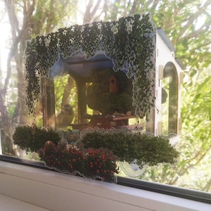 Bird feeder window. Colorful bird feeder on very strong suction cups with unique window decoration.