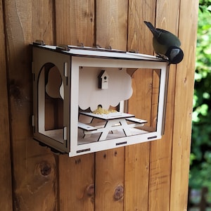 The Picnic Outdoor Bird Feeder is a unique place for birds. And a great decoration for the backyard of a bird lover.