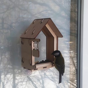 Handmade window bird feeder made of plywood, with the possibility of personalization
