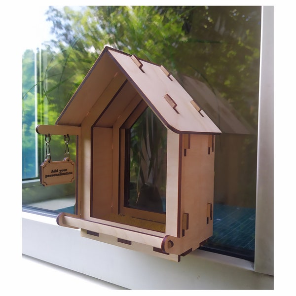 Wooden handmade bird feeder on the windows - a unique outdoor decor and an individual gift for nature lovers