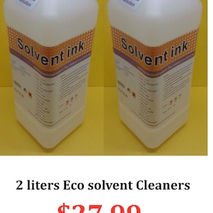May include: Two white plastic bottles of solvent ink with white caps and labels that read "Head cleaner solution." The bottles have labels with the words "Solvent ink" in a stylized font. The text "2 litres Eco solvent Cleaners" is below the bottles.