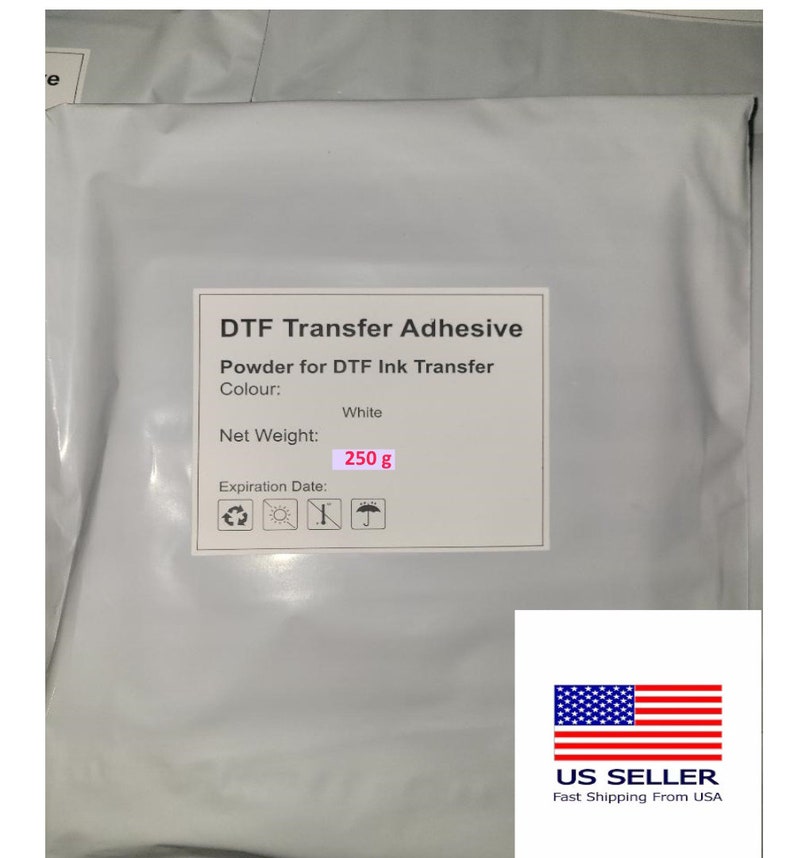 Peut inclure: Poudre adh&eacute;sive de transfert DTF blanche pour transfert d'encre DTF. Poids net : 250 grammes. L'emballage comporte un symbole de recyclage, un soleil, un symbole barr&eacute; et un parapluie.