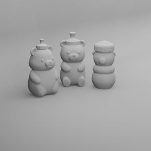 May include: Three light gray bear-shaped containers, each with a lid. The containers are in different poses, one sitting, one standing, and one stacked. The containers are likely for honey or other condiments.