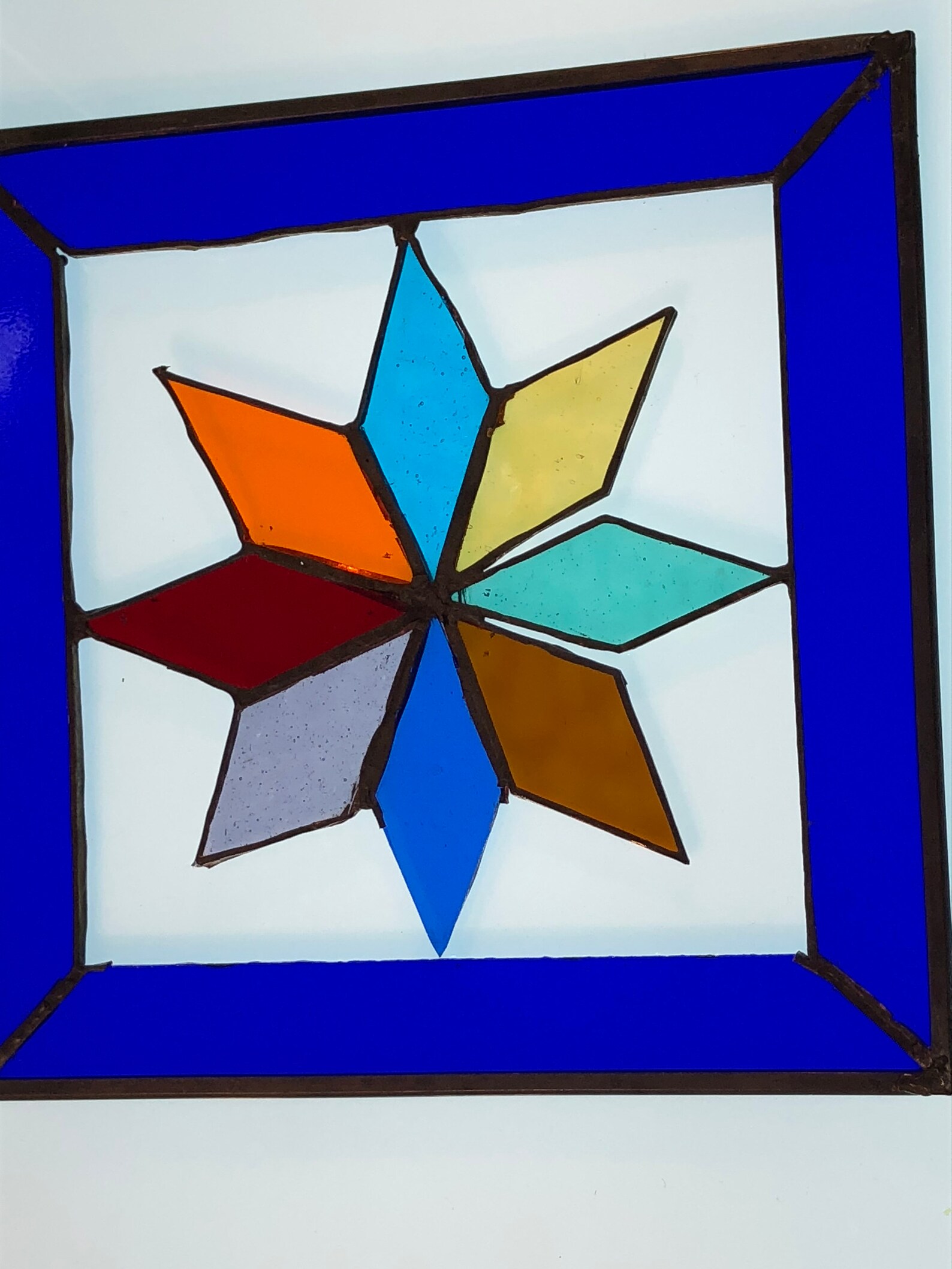 Multi-colored Stained glass star surrounded by deep blue | Etsy