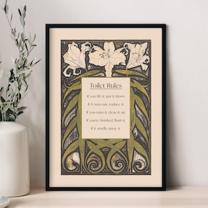 May include: A framed print with a vintage aesthetic featuring a floral design and the text "Toilet Rules" with a list of rules for using the toilet.