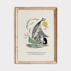 May include: A framed print featuring a whimsical illustration of cats sailing in a green boat. The sail is patchwork, and the sun shines above. The text at the bottom reads, "The Owl & the Pussycat went to sea, in a beautiful pen green boat."