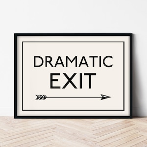 May include: Black and white framed print with the text "Dramatic Exit" and a black arrow pointing to the right.