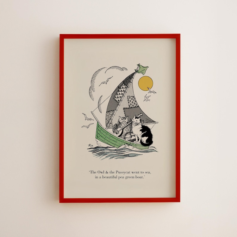 May include: Framed art print featuring an illustration of an owl and a cat sailing on a green boat. The sail is patchwork, and the sun and seagulls are in the sky. The text reads, "The Owl & the Pussycat went to sea, in a beautiful pea green boat."