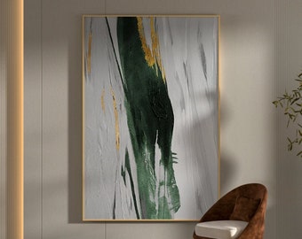 May include: Abstract painting with green and gold brushstrokes on a white background. The painting is framed in a thin, gold frame.