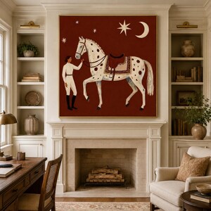 May include: A square wall art print featuring a white spotted horse with a saddle and a person in white equestrian attire standing on a deep red background with a crescent moon and stars depicted in the upper portion of the composition.