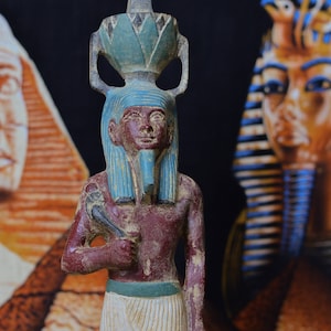 Statue of Nefertum, ancient Egyptian god of perfume and medicine, stone carving, made in Egypt