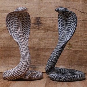 Statue of goddess Wadjet the cobra, and she is the patroness and  the joint protector of all Egypt made of stone Made in Egypt.