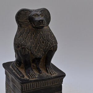 egyptian statue of a Hapi Figure of a seated baboon Hapi (Son of Horus) made in egypt
