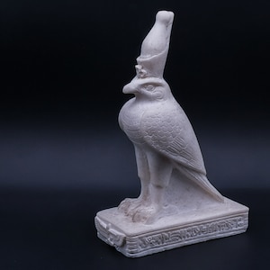 Egyptian art. statue of falcon bird god Horus marble stone made in egypt