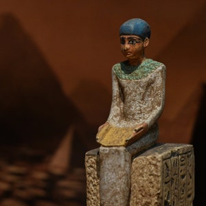 Statue of Egyptian art Seated statue of Imhotep god of midicine holding an open papyrus scroll STONE made in egypt