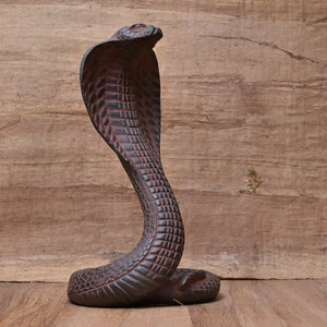 Statue of goddess Wadjet the cobra, and she is the patroness and  the joint protector of all Egypt made of stone Made in Egypt.
