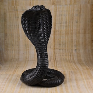 Statue of goddess Wadjet the cobra, and she is the patroness and  the joint protector of all Egypt made of stone Made in Egypt.