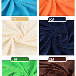 May include: Six fabric swatches in different colors. The swatches are arranged in two rows of three. The colors are turquoise, orange, cream, navy blue, green, and brown.