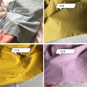 May include: Four fabric swatches in different colours: light blue, yellow, mustard yellow, and light purple. Each swatch has a number label: 29#, 30#, 31#, and 32#.