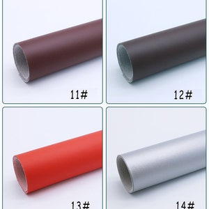 May include: Four rolls of faux leather in different colors: brown, dark brown, red, and silver. The rolls are labeled with numbers 11, 12, 13, and 14.