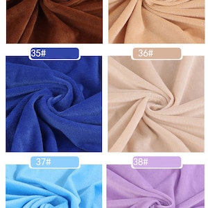 May include: Six fabric swatches in different colors. The swatches are arranged in two rows of three. The colors are brown, beige, blue, beige, light blue, and purple.