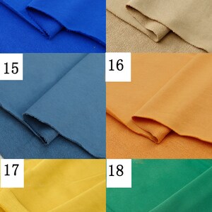 May include: Four fabric swatches in different colors: royal blue, beige, blue, and orange. The swatches are folded in half and the edges are visible.