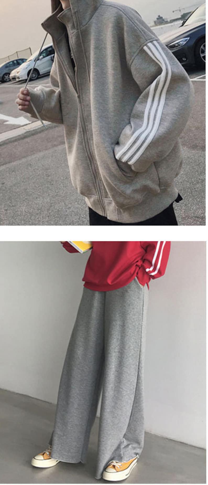 May include: A gray sweatshirt with white stripes on the sleeves. The sweatshirt has a zipper closure and a high neckline. The model is also wearing gray sweatpants with white stripes on the sides.