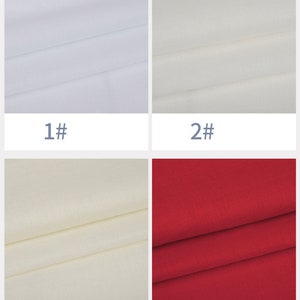 May include: Four fabric swatches in different colors: white, off-white, cream, and red. The swatches are folded in half and show the texture of the fabric.