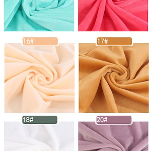 May include: Six fabric swatches in different colors. The swatches are arranged in two rows of three. The colors are turquoise, pink, peach, brown, white, and purple.