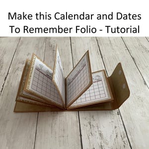 May include: A brown paper calendar folio with a simple design. The folio is open to show the months of March and August. The text "Make this Calendar and Dates To Remember Folio - Tutorial" is at the top of the image.