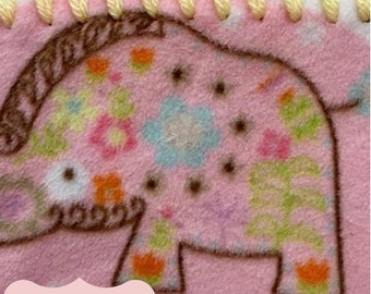 May include: A PDF crochet pattern for a pink and brown elephant blanket with a multi-colored crocheted border. The border is made with pink, purple, green, and yellow yarn.
