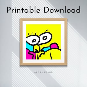May include: A square wooden frame containing a digital illustration with a bright yellow background, featuring a stylized cartoon character with large white eyes, black outlines, and accents of cyan and magenta. The text reads Printable Download and Art by Hakon.