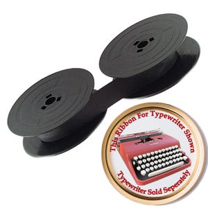 May include: A black typewriter ribbon on two circular plastic spools. A circular graphic shows a red typewriter with the text: This Ribbon For Typewriter Shown. Typewriter Sold Seperately.