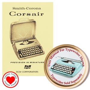 May include: An image featuring a vintage Smith-Corona Corsair typewriter and a round pin. The pin reads "User Manual for Typewriter Shown" and "Typewriter Sold Separately". The typewriter is light blue with white keys.