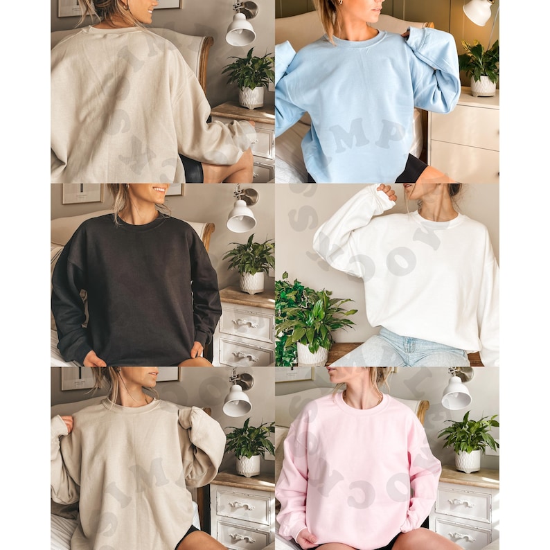 May include: Five different colored sweatshirts, each with a crew neck and long sleeves. The colors are beige, black, light blue, white, and pink.