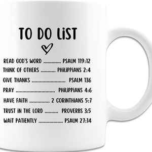 May include: White ceramic mug with the words "TO DO LIST" in black, followed by a heart symbol. The list includes phrases like "Read God's Word" and "Think of Others," with corresponding Bible verses. A practical and inspirational gift.