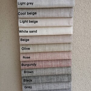 May include: A swatch card showing 13 different fabric colors, including light grey, cool beige, light beige, white sand, beige, olive, rose, burgundy, brown, black, grey, blue, and navy.