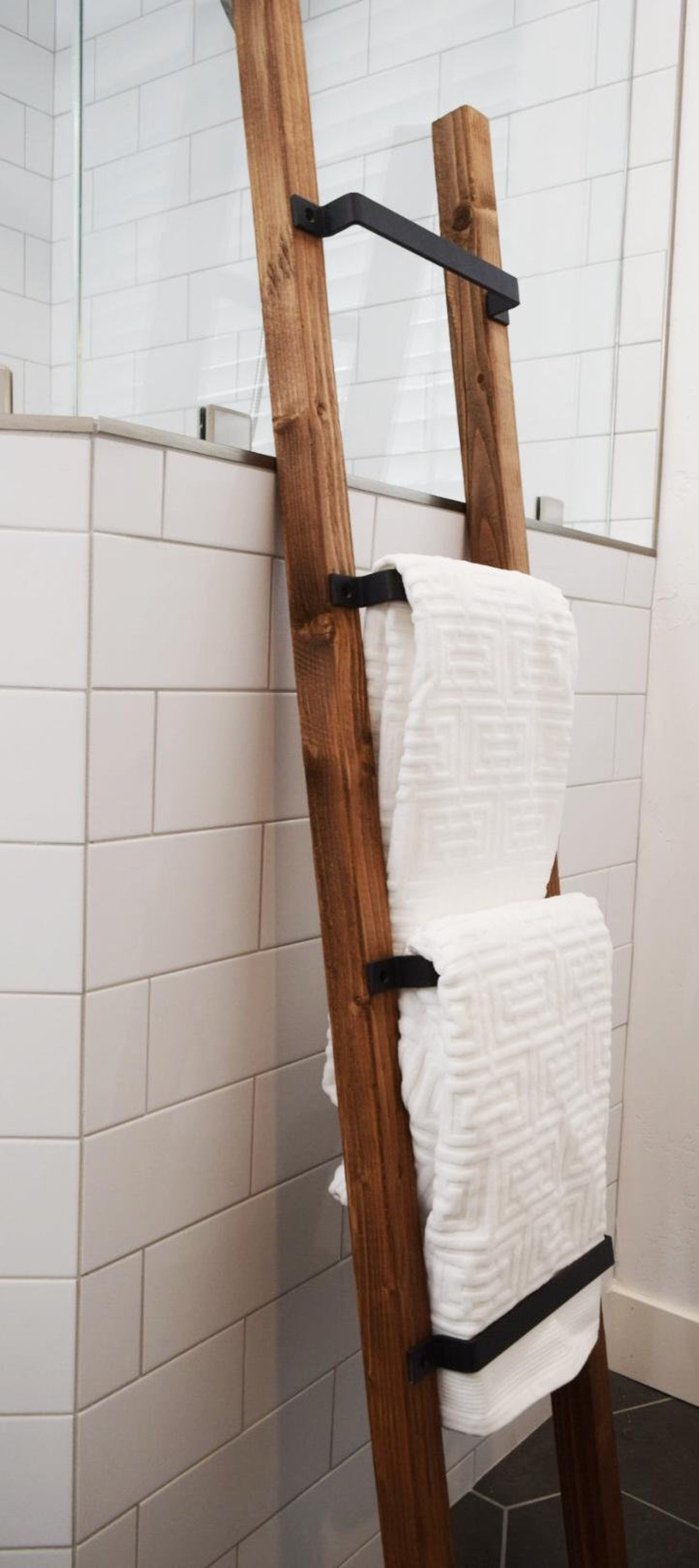 black wooden towel ladder