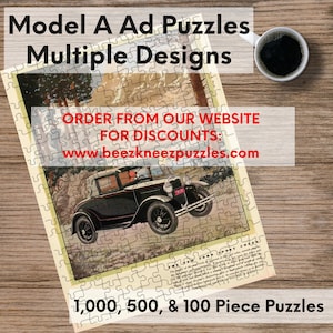 May include: A vintage advertisement for Model A Ad Puzzles featuring a black 1920s Ford Model A car driving through a mountain landscape. The ad text reads "Order from our website for discounts: www.beezkneezpuzzles.com" and "1,000, 500, & 100 Piece Puzzles".