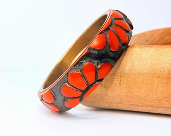 Sculptural Orange Bakelite Bangle Black Floral Carved Brass Lined Vintage