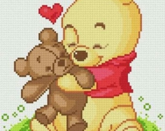 May include: A yellow bear with a red shirt is hugging a brown teddy bear. A red heart is floating above the bear's head.