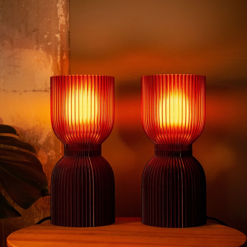 Handcrafted DIABOLO lamp with warm amber glow, made from recycled plastic. Ideal for adding soft ambient lighting to boho, modern, or minimalist decor. Suitable for living rooms, bedrooms, or reading nooks to create a relaxing and sustainable space.