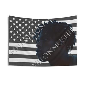 May include: A black and white tapestry featuring the American flag design with a portrait of a person in the foreground. The person is in profile, with dark hair and skin. The text "MELONMUSHIE" is printed diagonally across the image.