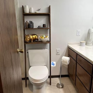 We combine Bathroom Shelves Storage with A Over the Toilet Ladder Shelf,. Here is SWooden Above Toilet Back Paper Stand Organizer as a easy to assemble over toilet storage as a bath rooms furniture!