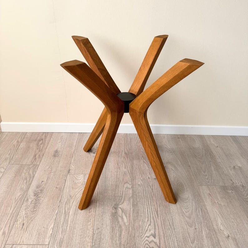 Solid Beech Wood Triple Butterfly Table Leg 🪵 
Bring the warmth of natural wood and modern design into your home! This handcrafted table leg perfectly complements round tabletops made of glass, epoxy, marble, or solid wood. Its sturdy construction and elegant style add both charm and function to any space.