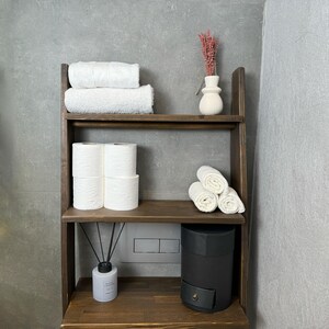 We combine Bathroom Shelves Storage with A Over the Toilet Ladder Shelf,. Here is SWooden Above Toilet Back Paper Stand Organizer as a easy to assemble over toilet storage as a bath rooms furniture!