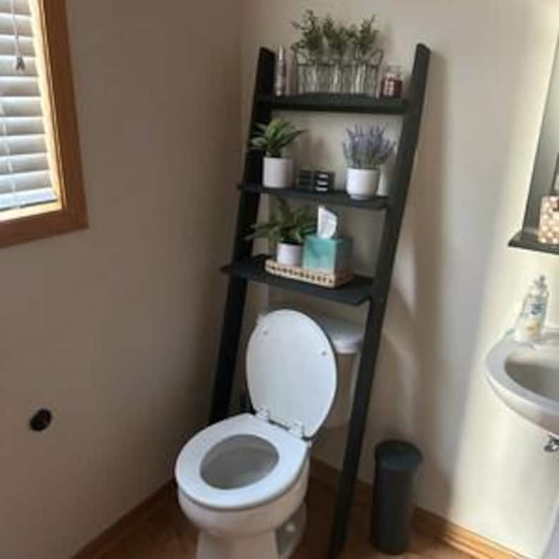 We combine Bathroom Shelves Storage with A Over the Toilet Ladder Shelf,. Here is SWooden Above Toilet Back Paper Stand Organizer as a easy to assemble over toilet storage as a bath rooms furniture!
