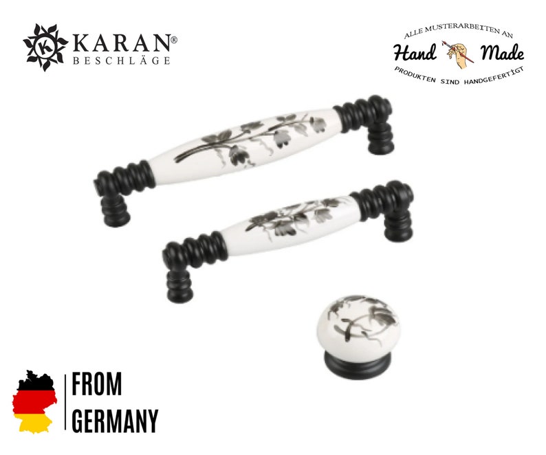 May include: Set of three black and white ceramic cabinet knobs with floral designs. The knobs are made by KARAN Beschl&auml;ge and are hand-made. The text "Hand Made" is visible in the image.